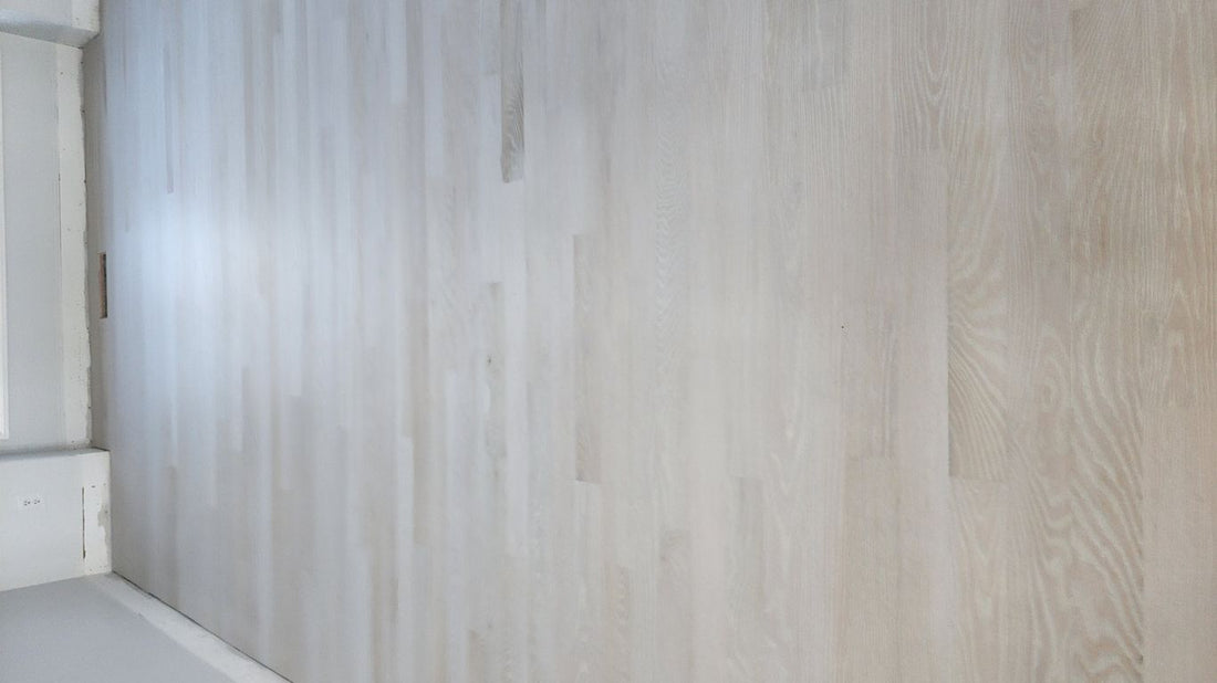 Light wooden floor with a smooth, modern finish.